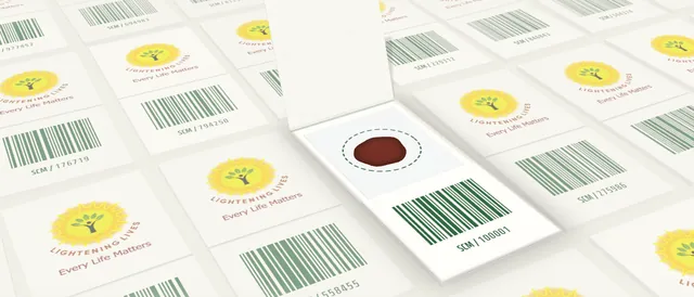 An open dried blood spot card among closed ones: a single dried blood spot inside one dashed collection circle, above a barcode and sample code.
