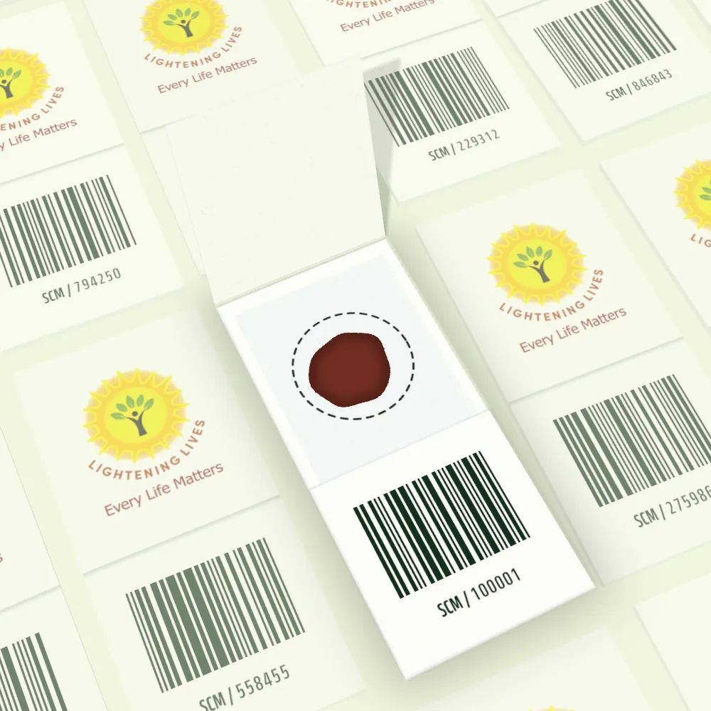 The open card seen from above: a single dried blood spot inside its dashed collection circle, above a barcode and sample code.